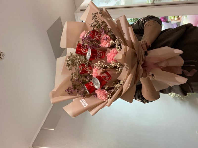 Bouquet of flowers and Coca-Cola