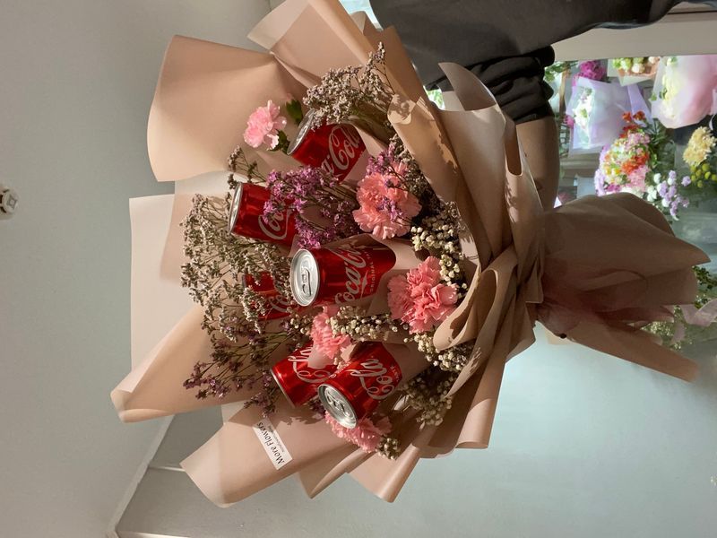 Bouquet of flowers and Coca-Cola